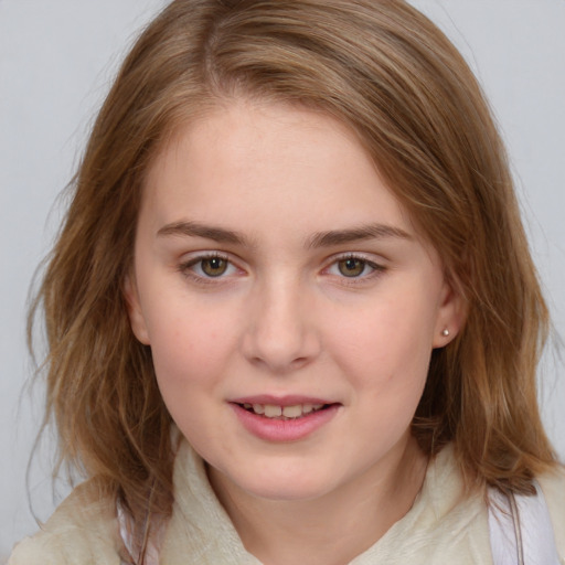 Joyful white young-adult female with medium  brown hair and blue eyes