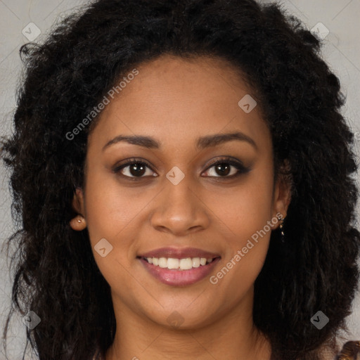 Joyful black young-adult female with long  brown hair and brown eyes