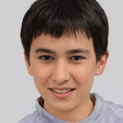 Joyful white child male with short  brown hair and brown eyes