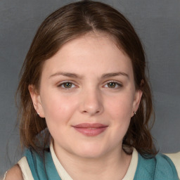 Joyful white young-adult female with medium  brown hair and blue eyes