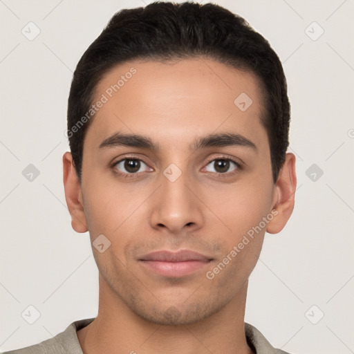 Joyful white young-adult male with short  black hair and brown eyes