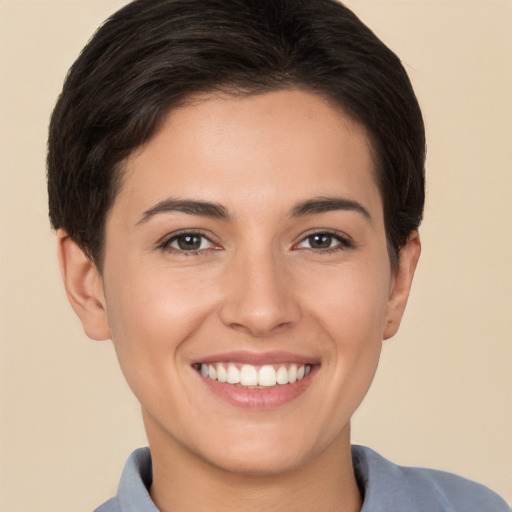 Joyful white young-adult female with short  brown hair and brown eyes