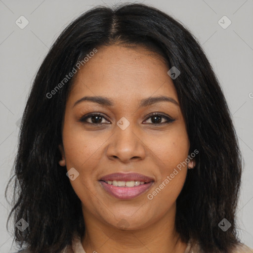 Joyful black young-adult female with long  brown hair and brown eyes