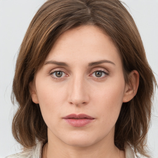 Neutral white young-adult female with medium  brown hair and grey eyes