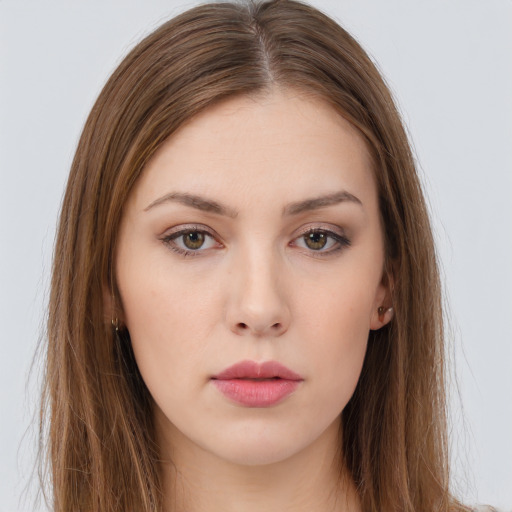 Neutral white young-adult female with long  brown hair and brown eyes