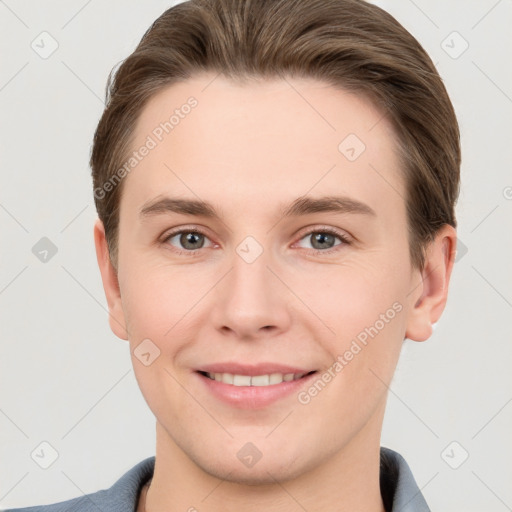 Joyful white young-adult female with short  brown hair and grey eyes