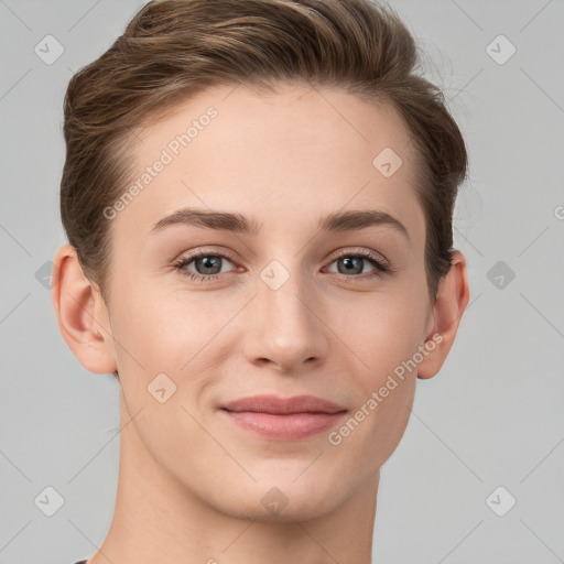 Joyful white young-adult female with short  brown hair and grey eyes