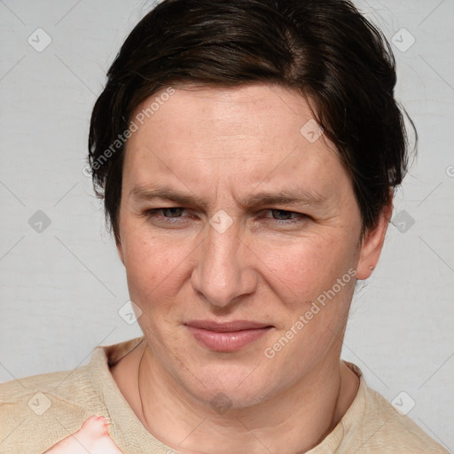 Joyful white adult female with short  brown hair and brown eyes