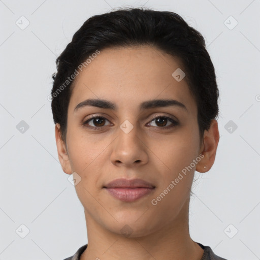 Joyful latino young-adult female with short  black hair and brown eyes