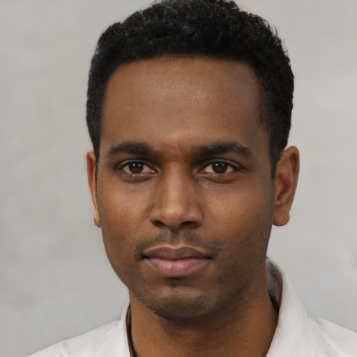 Neutral black young-adult male with short  black hair and brown eyes