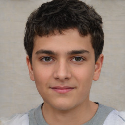 Joyful white child male with short  brown hair and brown eyes