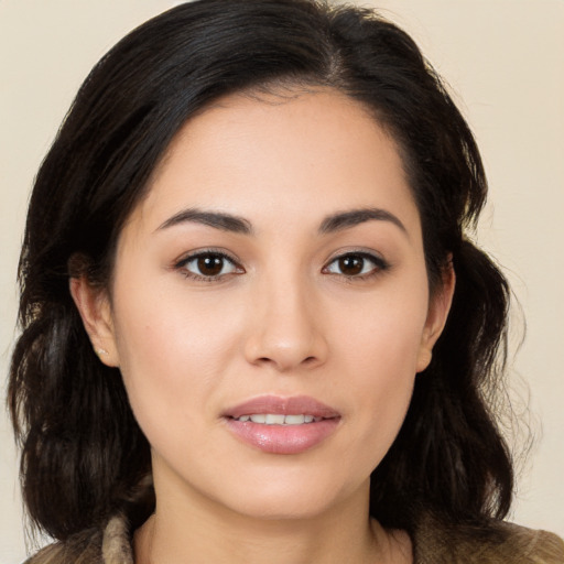 Joyful white young-adult female with medium  black hair and brown eyes