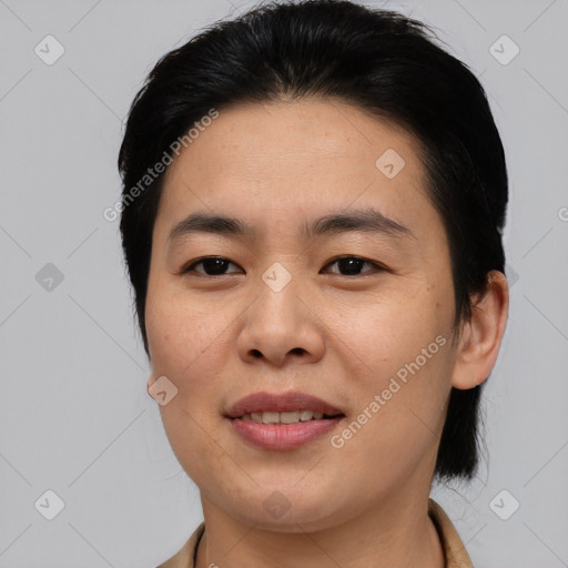 Joyful asian young-adult female with short  brown hair and brown eyes