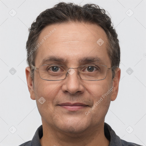 Joyful white adult male with short  brown hair and brown eyes