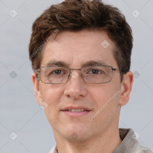 Joyful white adult male with short  brown hair and grey eyes