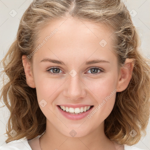 Joyful white child female with long  brown hair and brown eyes