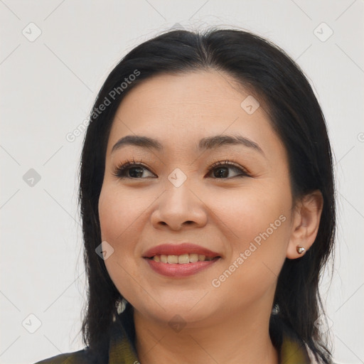 Joyful asian young-adult female with long  black hair and brown eyes