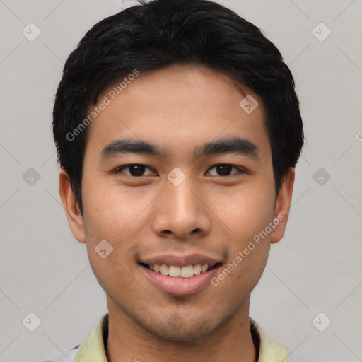 Joyful asian young-adult male with short  black hair and brown eyes