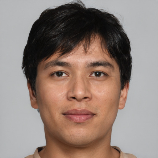 Joyful asian young-adult male with short  brown hair and brown eyes