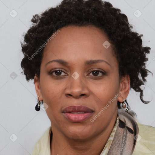 Joyful black adult female with short  brown hair and brown eyes