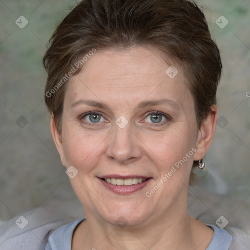 Joyful white adult female with short  brown hair and grey eyes