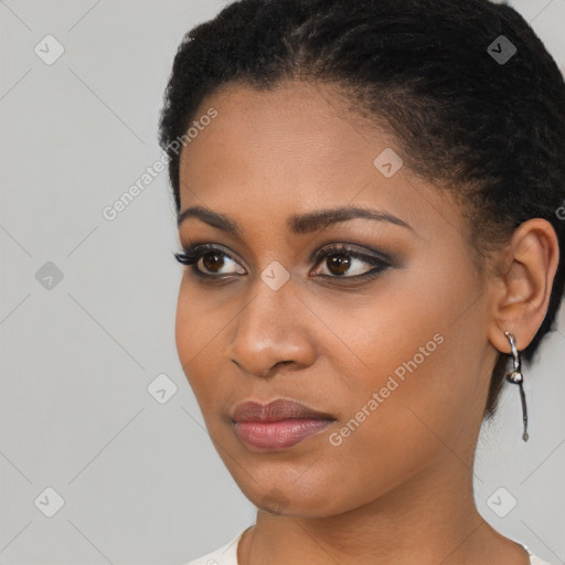 Joyful black young-adult female with short  black hair and brown eyes