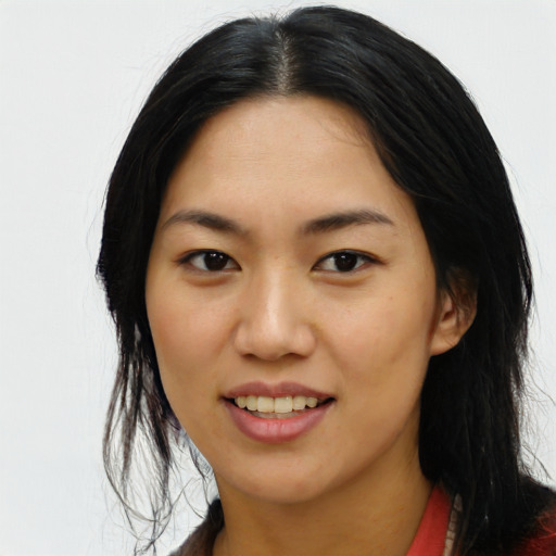 Joyful asian young-adult female with long  black hair and brown eyes