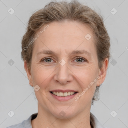 Joyful white adult female with short  brown hair and grey eyes