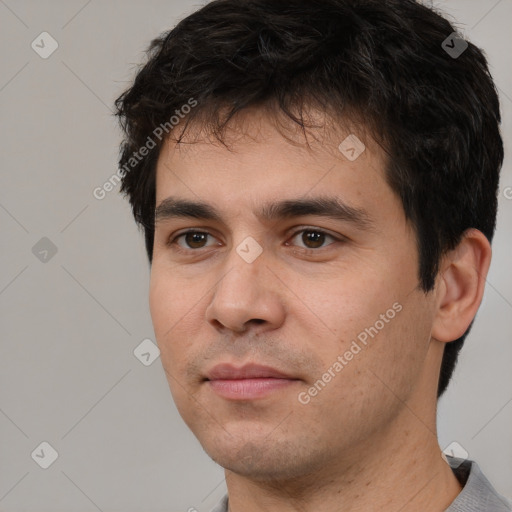 Neutral white young-adult male with short  black hair and brown eyes