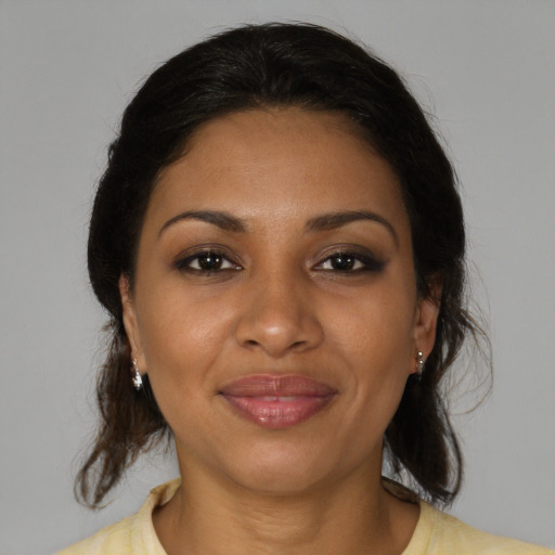 Joyful black young-adult female with medium  brown hair and brown eyes
