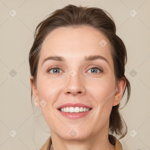 Joyful white young-adult female with medium  brown hair and blue eyes