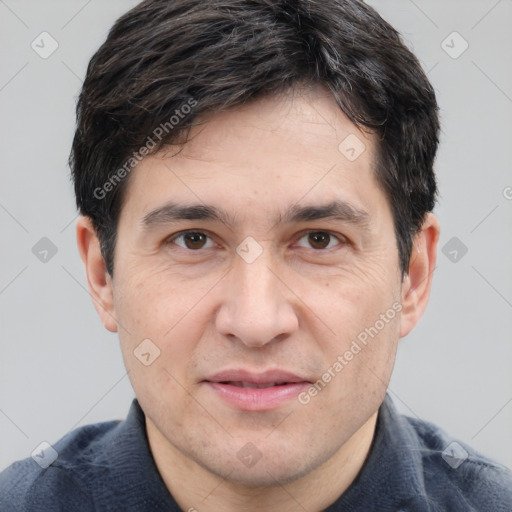 Joyful white adult male with short  brown hair and brown eyes