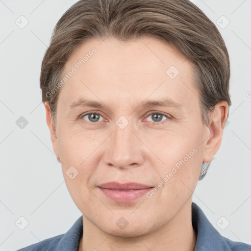 Joyful white adult female with short  brown hair and grey eyes