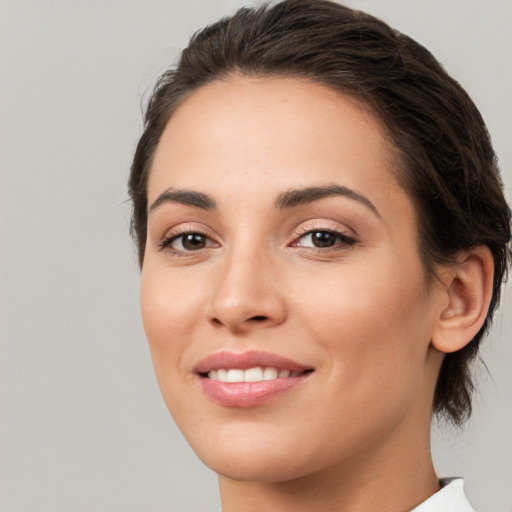 Joyful white young-adult female with medium  brown hair and brown eyes