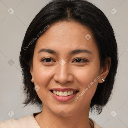 Joyful latino young-adult female with medium  brown hair and brown eyes