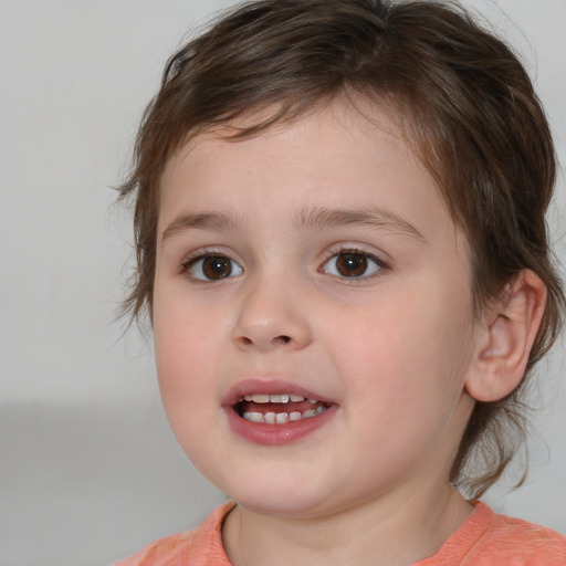 Joyful white child female with medium  brown hair and brown eyes