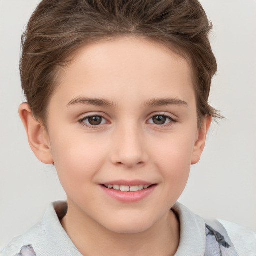 Joyful white child female with short  brown hair and brown eyes