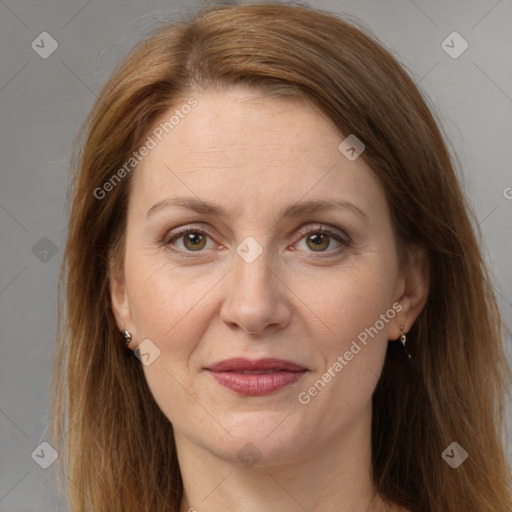 Joyful white adult female with long  brown hair and grey eyes