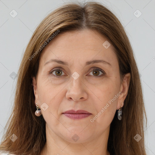 Joyful white adult female with long  brown hair and brown eyes