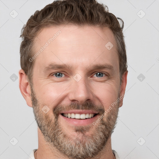 Joyful white adult male with short  brown hair and grey eyes