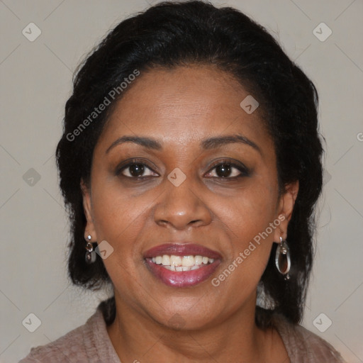 Joyful black adult female with medium  brown hair and brown eyes