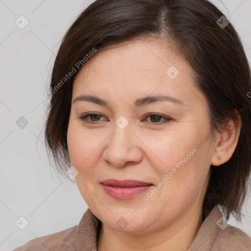 Joyful white adult female with medium  brown hair and brown eyes