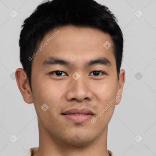 Joyful asian young-adult male with short  black hair and brown eyes