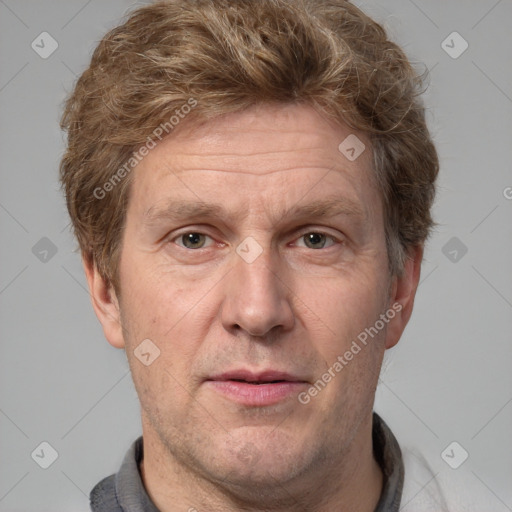 Joyful white adult male with short  brown hair and grey eyes