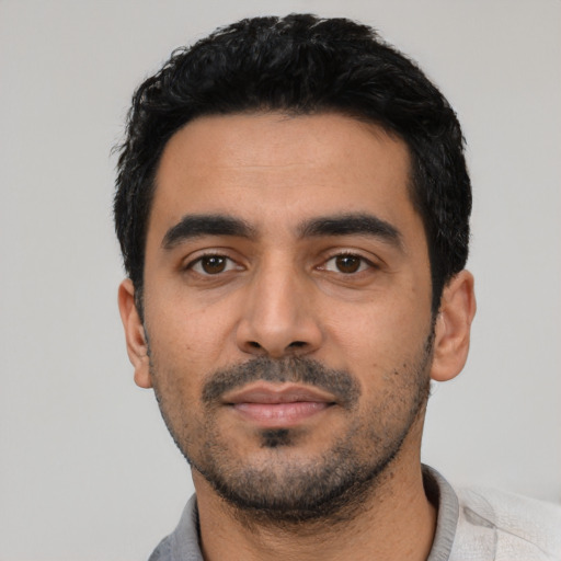 Neutral latino young-adult male with short  black hair and brown eyes