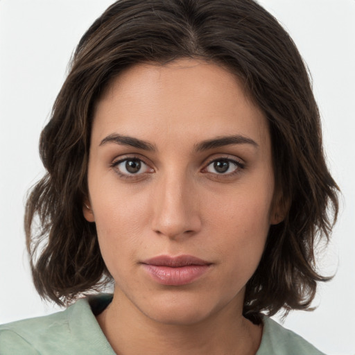 Neutral white young-adult female with medium  brown hair and brown eyes