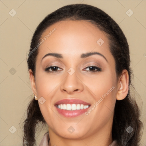 Joyful latino young-adult female with long  black hair and brown eyes