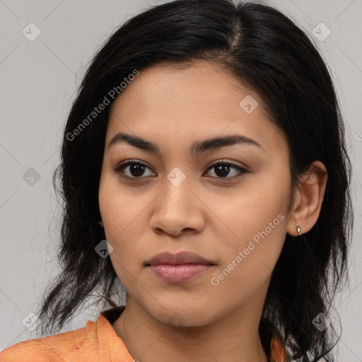 Joyful latino young-adult female with medium  brown hair and brown eyes