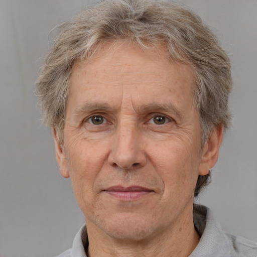 Joyful white middle-aged male with short  brown hair and brown eyes