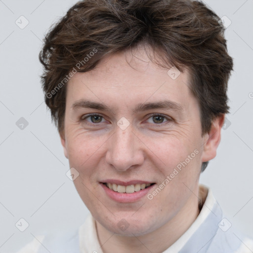 Joyful white adult male with short  brown hair and grey eyes